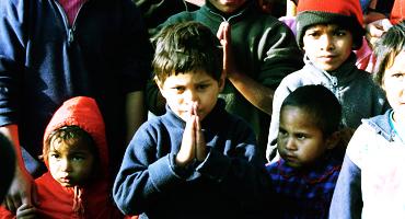 Volunteer Teacher with School Children in Nepal.