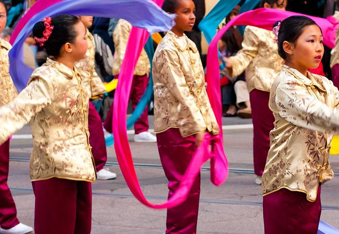 Children dancing in a parade in China
